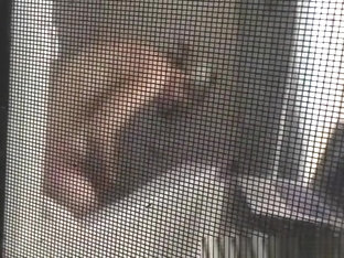 Voyeur Secretly Films His MILF Neighbor Through Window