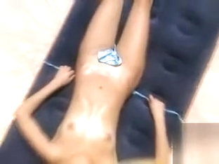 Skinny Bikini Beauty Tans Naked Under The Sun