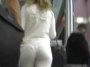 Blonde In White Elegant Costume Being Followed By A Spy Cam