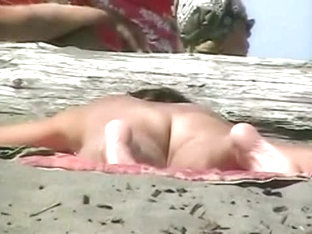 A Voyeur Catches A Husband Spanking His Naked Wife On The Beach