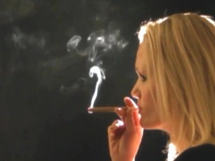 Jenna Smokes A Cigar