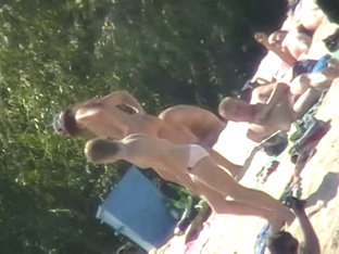 Hot Brunette Bares It All To The Nudist Beach Voyeur