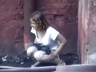 Girl Pees In Public Next To Old Buildind