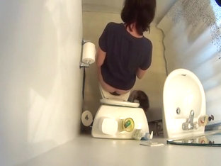 Hidden Cam Over The Toilet Catches Woman Peeing