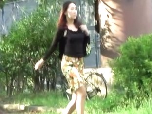 Tantalizing Long-legged Oriental Woman Flashes Her Thong During Sharking Scene