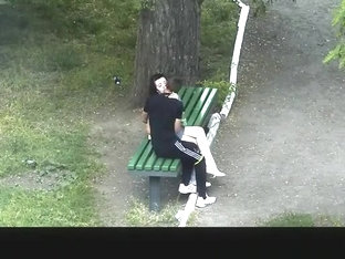 Teen Couple Making Out In Public Park Bench