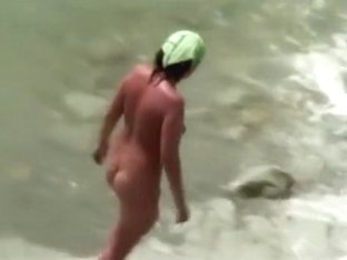 Voyeur Tapes A MILF Jerking And Sucking Her Man On A Nude Beach