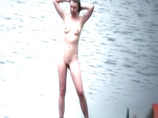 Nudist Washes Head In Beach