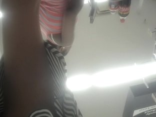Babe In Striped Skirt Showing Her Sexy Legs On The Spy Camera
