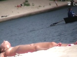 Sexy Brunette Swears Her Big Tits On The Nude Beach