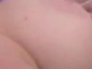 Busty Holly sucking her own tits and masturbates her pussy