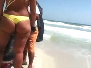 Woman with a big ass on the beach