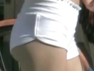 Sexy hips and hot ass in white shorts in the candid scene