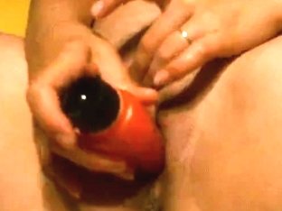 Busty Mature Smacks Herself With A Red Dildo