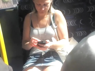 Upskirt sights of a girl texting in the bus