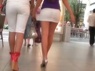 Two Absolutely Stunning Babes Show Their Round Asses