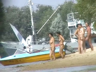 Hot beach voyeur video shows mature nudists enjoying each others company.