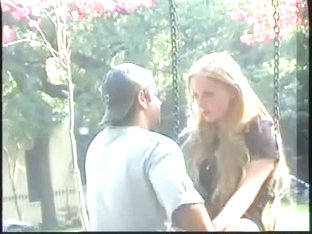 Blonde's kissing a guy on a public street