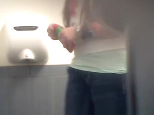 Long hair teen seats in toilet to pee