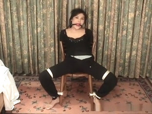 Asian Bondage Victim Bound To A Chair