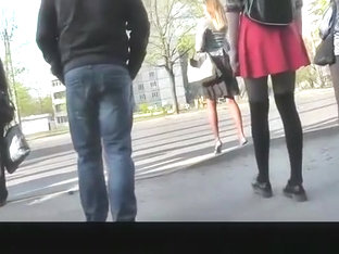 Girl in red short skirt and black leggings upskirted