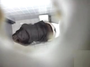 Ceiling cam films a girl peeing in the toilet