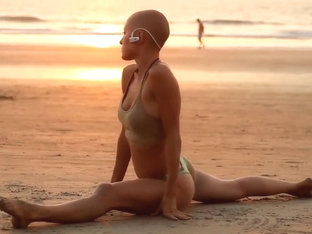 Bald Beauty Doing Yoga By The Sea