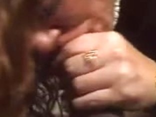 Redhead likes engulfing large dark knob.