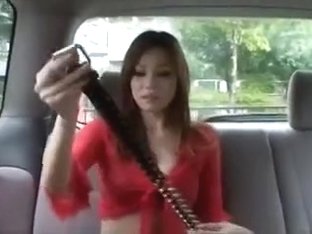 Mixed Asian Babe Changing Clothes In Car