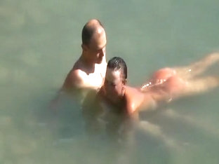 Nudist Couple Enjoying The Fresh Water