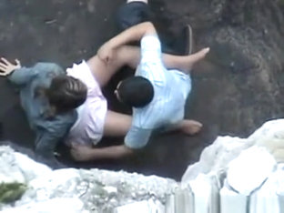 Lovers On Rocky Beach