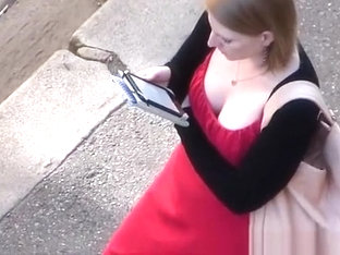 Looking to the neckline of the girl in a red dress