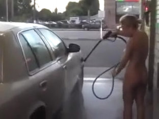 Hot blonde looker with big tits washes a car in the nude