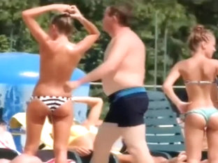 Topless skinny girl looks sexy at the water park