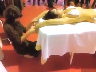 Double massage in public of an Asian bikini girl