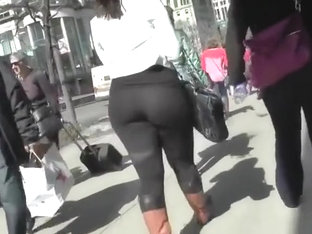 Big butt woman walks the city streets in spandex