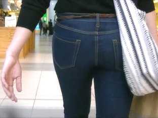 Candid ass in tight jeans and boots