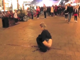 Brave Blonde Urinates On The Middle Of The Crowded Street!