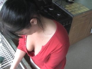 Free down blouse video of a pretty girl washing dishes