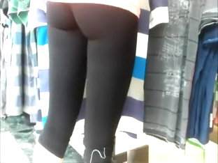 Woman In Black Leggings Checking Some Clothes