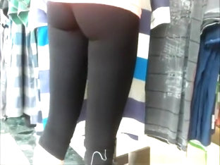 Woman in black leggings checking some clothes