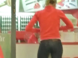 Street candid blonde with long slender legs in the mall