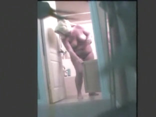 Chubby amateur gets clean in voyeur shower video