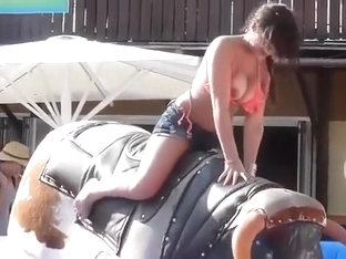 Bikini Girl Rides Mechanical Bull Outdoors