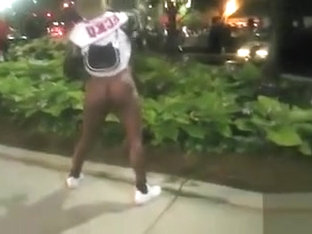 Black mama exposes her big tits on the street