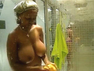 Black amateur with big breasts in voyeur shower scene