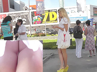 Sexy Blonde In White Dress Lures Up Skirt Camera