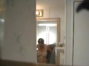 Peeped mother steps out of a shower