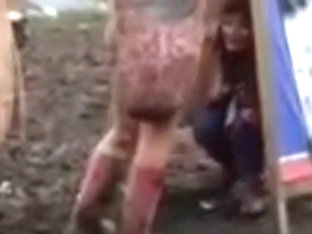 Hippie Girl Peeing In The Mud At Concert