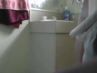 A Sexy Athlete Girl Takes A Shower Voyeur Video